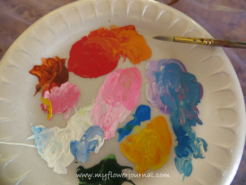Use a paper plate to put your paints on for your splattered paint flower garden-myflowerjournal.com