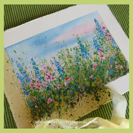 After the paint is dry you can remove the masking tape and see your finished splattered paint flower art-myflowerjournal.com After the paint is dry you can remove the masking tape and see your finished splattered paint flower garden-my flower journal